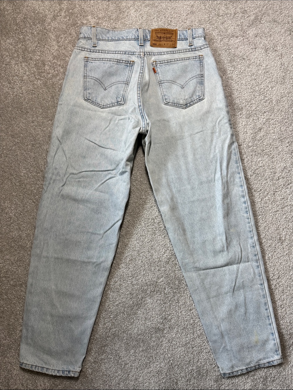 VINTAGE LEVI'S 560 LOOSE TAPERED ORANGE TAB JEANS MENS 31X30*29* HEMMED STAINED